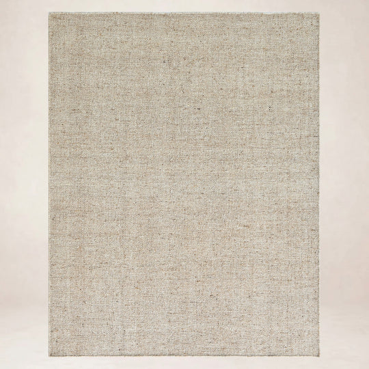 Desert Weave Sand rug under a dining table, seen from above