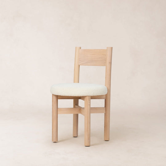 Teddy dining chair in natural boucle with a wood frame