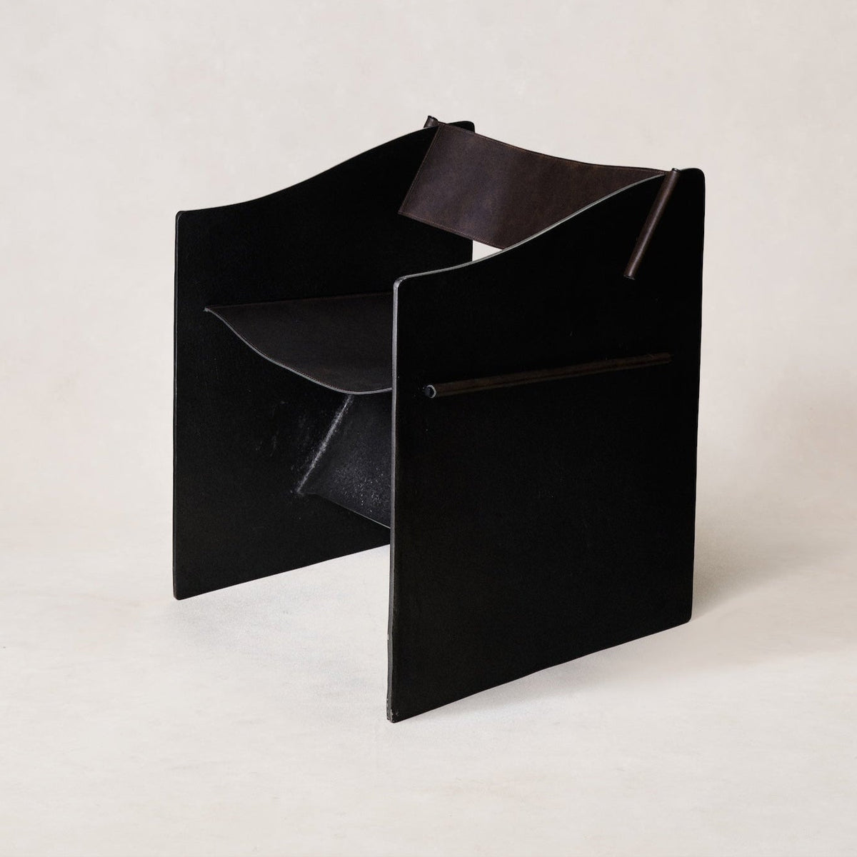 brutalist-accent-chair-faux-black-leather