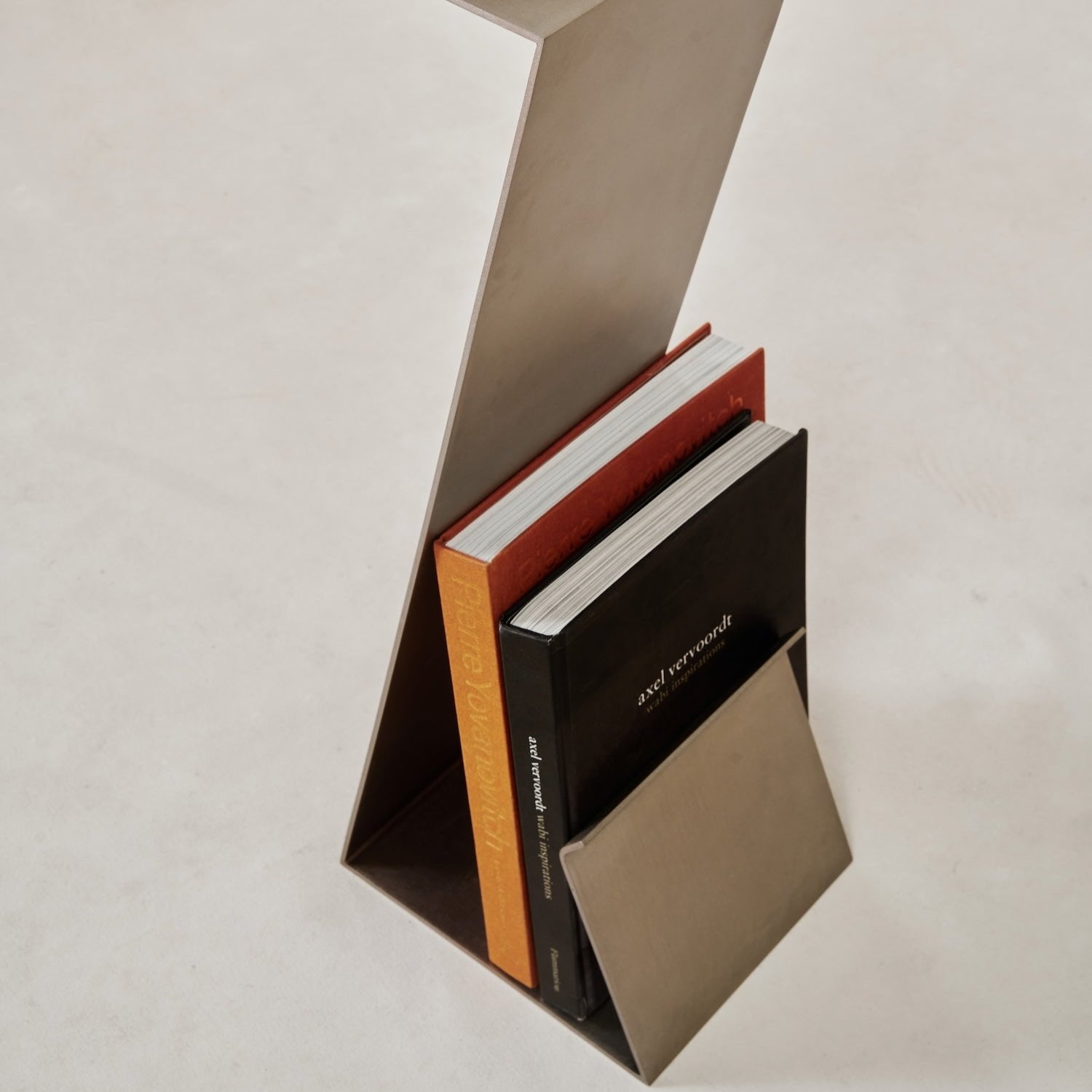 Zig Zag cocktail table standing with books.